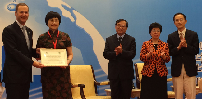 July 2014- presenting to Prof Zhu Shanzhu, president of the Society of General Practice of the Chinese Medical Association; in the presence of Dr Margaret Chan (second from right)