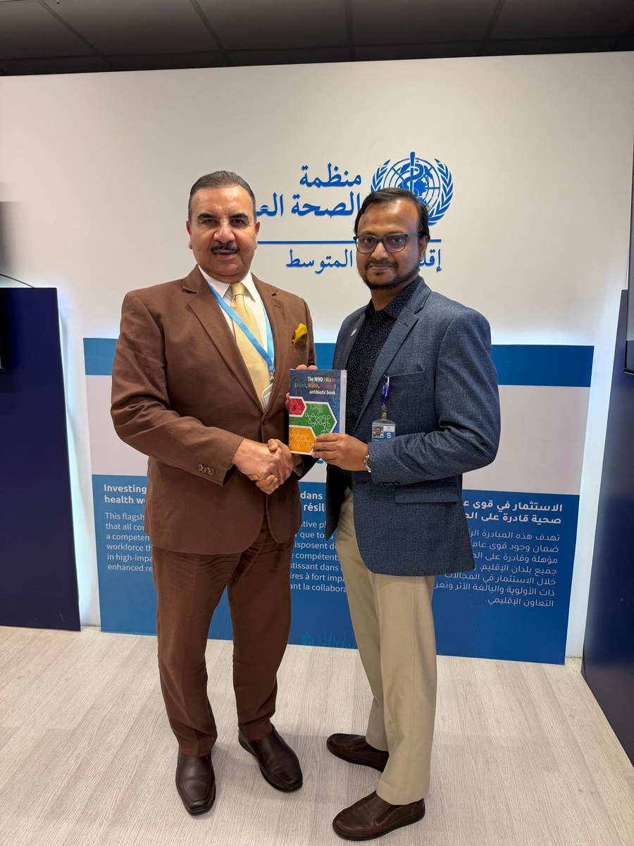 Prof Dr Faisal A. Alnaser and Dr Shaffi Koya with the WHO AWaRe antibiotic book
