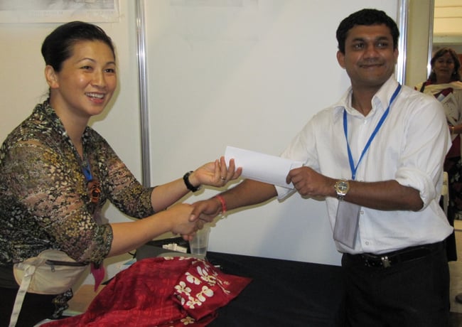 Yvonne Chung, WONCA Administrative Manager  - well known to many colleagues for her calm and efficient assistance always given willingly and a with a smile - seen here with Dr Naidu of Fiji